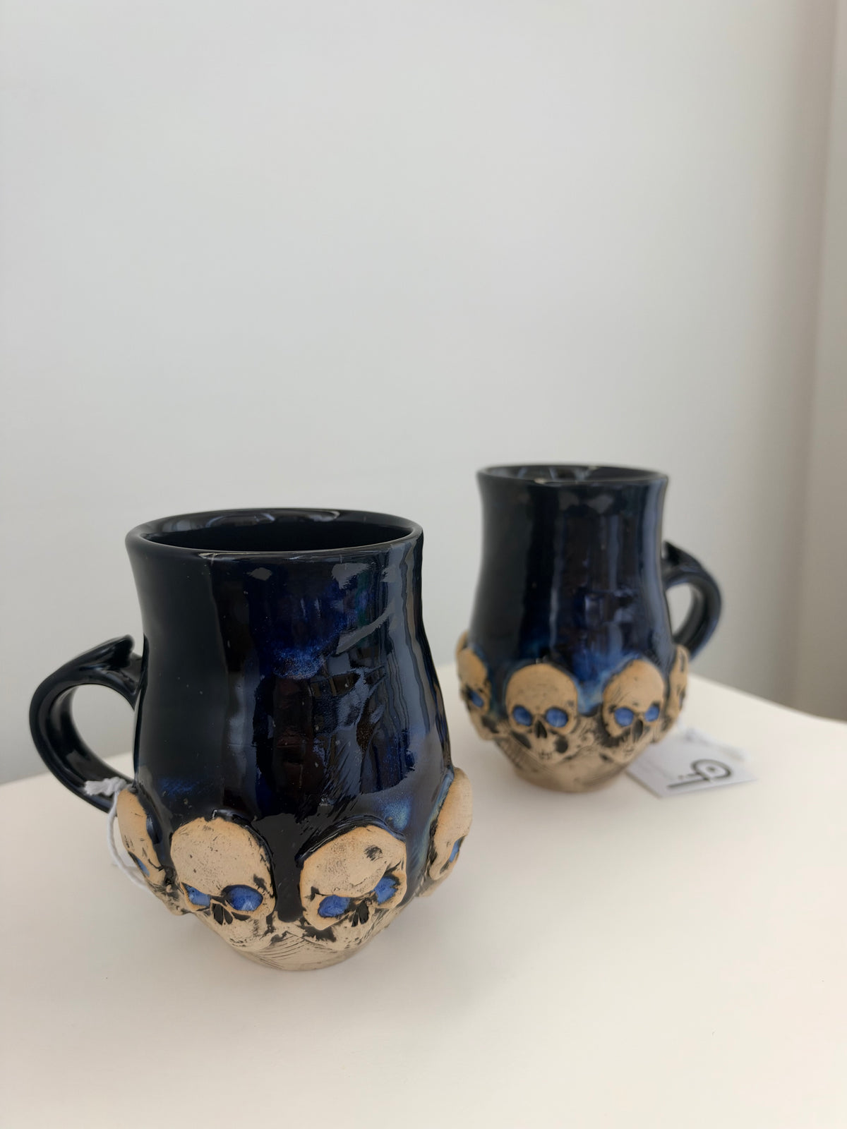 Blue-Black Skull Mugs by Chloe Foster